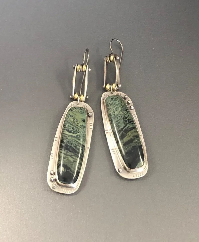 Geometric two-colour marble pattern alloy earrings with simple contemporary design