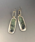 Geometric two-colour marble pattern alloy earrings with simple contemporary design