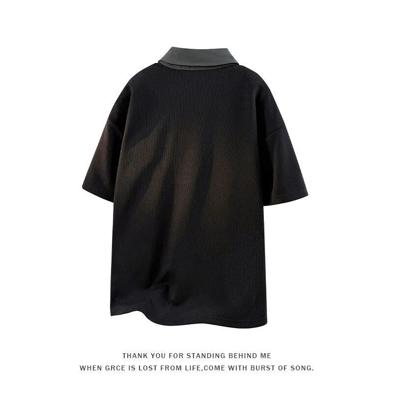Men's black short-sleeve pullover sweater with a structured padded Henry collar.