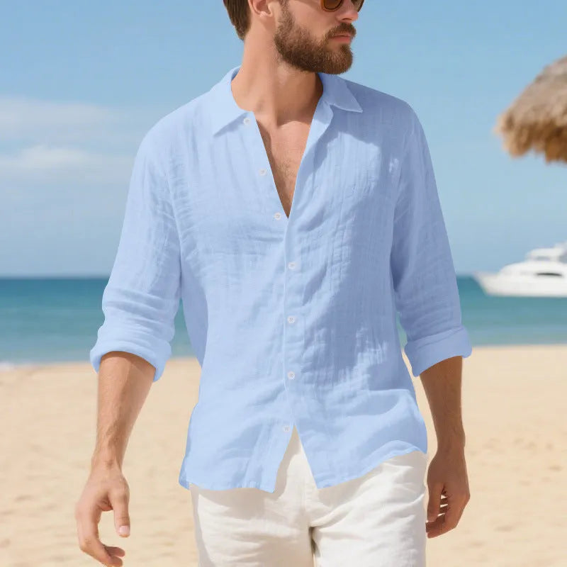 Man wearing a loose-fit linen casual shirt in a light blue colour, showing the non-iron style.