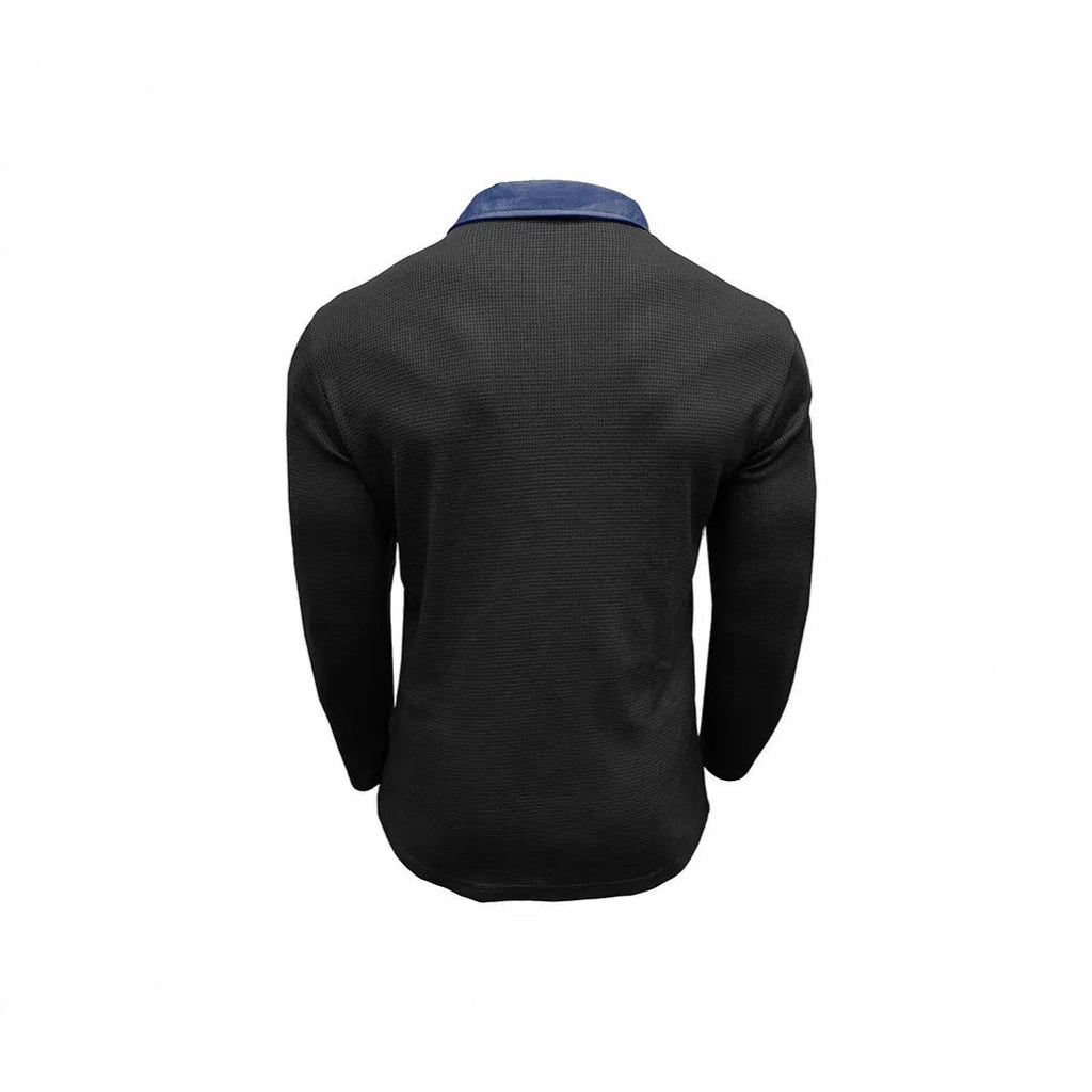 Man wearing a long-sleeved waffle-texture polo shirt with an asymmetric design in a dark colour.