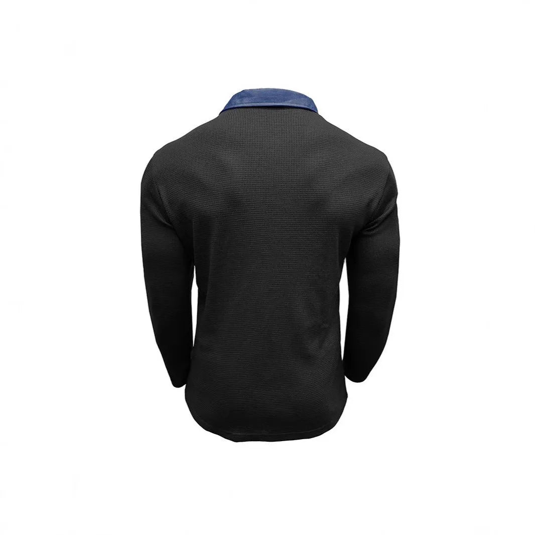 Man wearing a long-sleeved waffle-texture polo shirt with an asymmetric design in a dark colour.