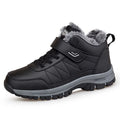 Men's high-top hiking shoes in black, with lace-up closure and rubber sole on outdoor ground