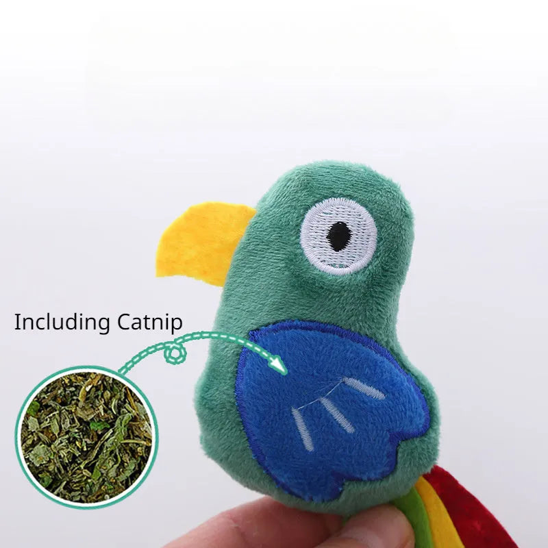 Plush green parrot-shaped cat toy with catnip, shown next to cow and crocodile versions.