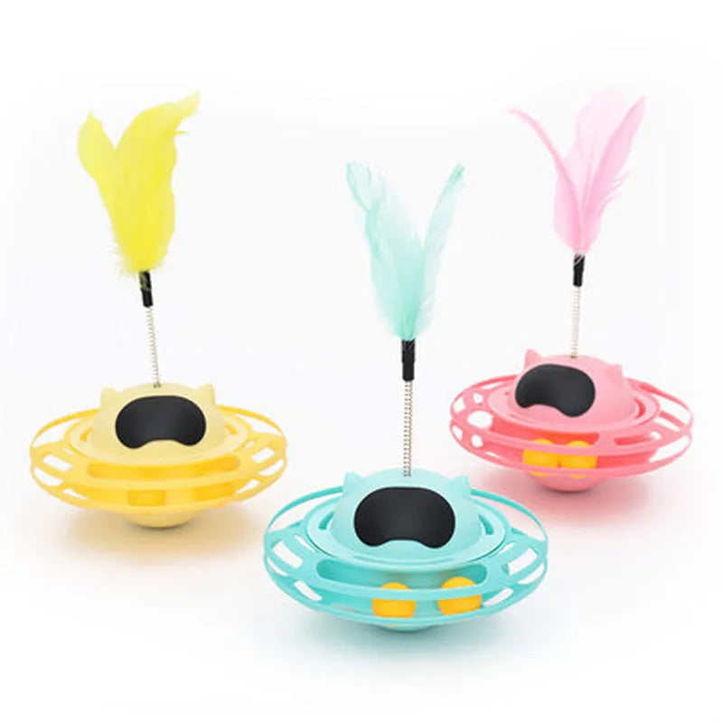 Pink cat stick toy with self-righting tumbler turntable measuring 17cm by 10cm