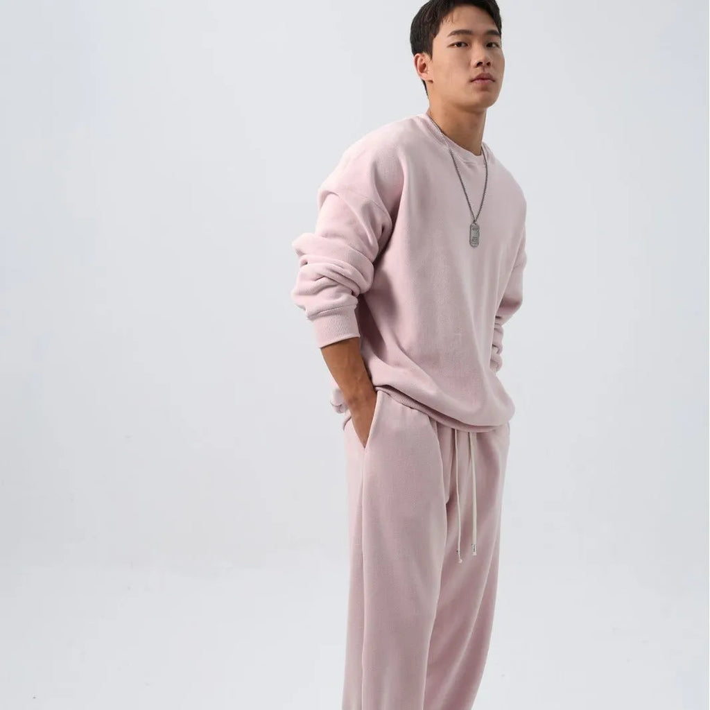 Men's loose fit polar fleece sports suit in army green, showing jacket and trousers.