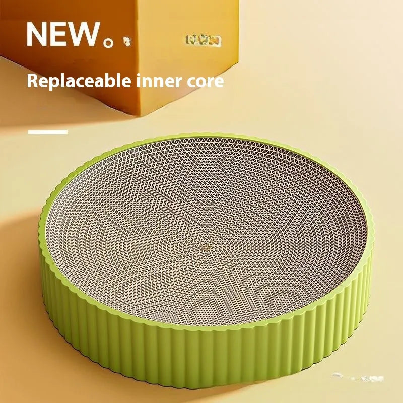 Round green cat scratching board with corrugated paper insert measuring 55cm diameter with two replacement refills
