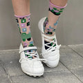 Women's silver lace-up bow sports shoes with a round toe and mid heel on a white background.
