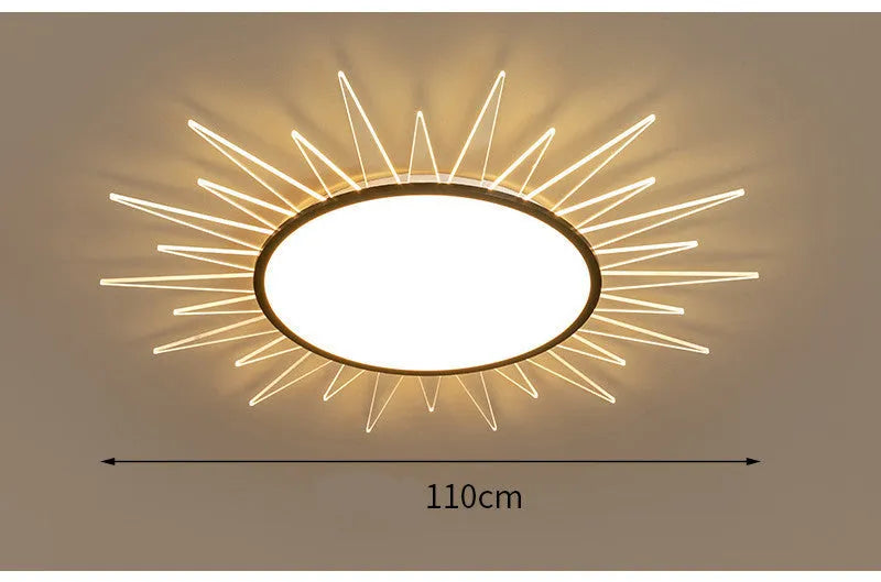 Modern round aluminium ceiling lamp with LED light source on a white ceiling.