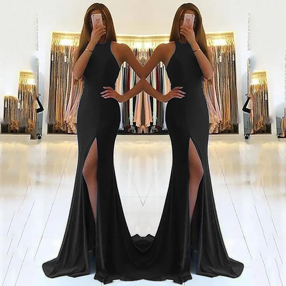 Long red knitted evening dress with hollow design detail on the skirt and a hanging neckline.
