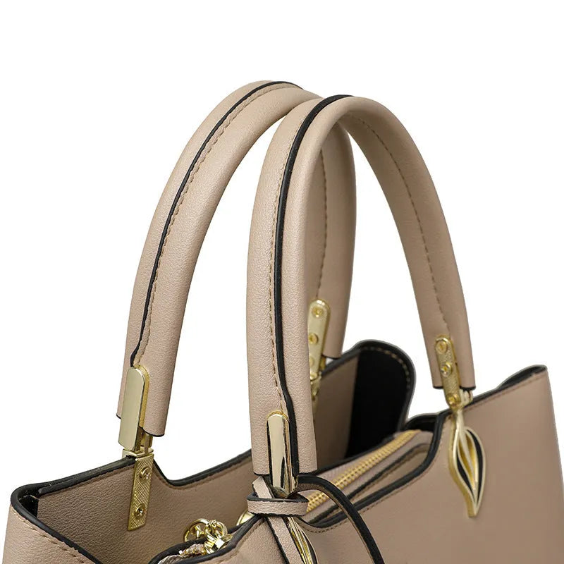 Women's black PU leather messenger bag with shoulder strap and sewing thread detailing