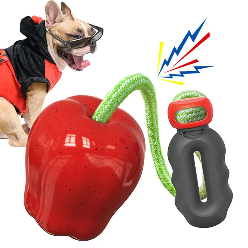 Green apple-shaped plastic dog toy with treat-dropping ball and molar-textured surface