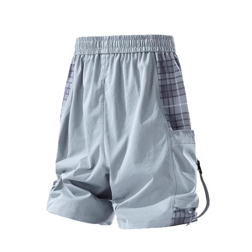 Men's loose-fit cargo shorts in grey with plaid stitching and cargo pockets.
