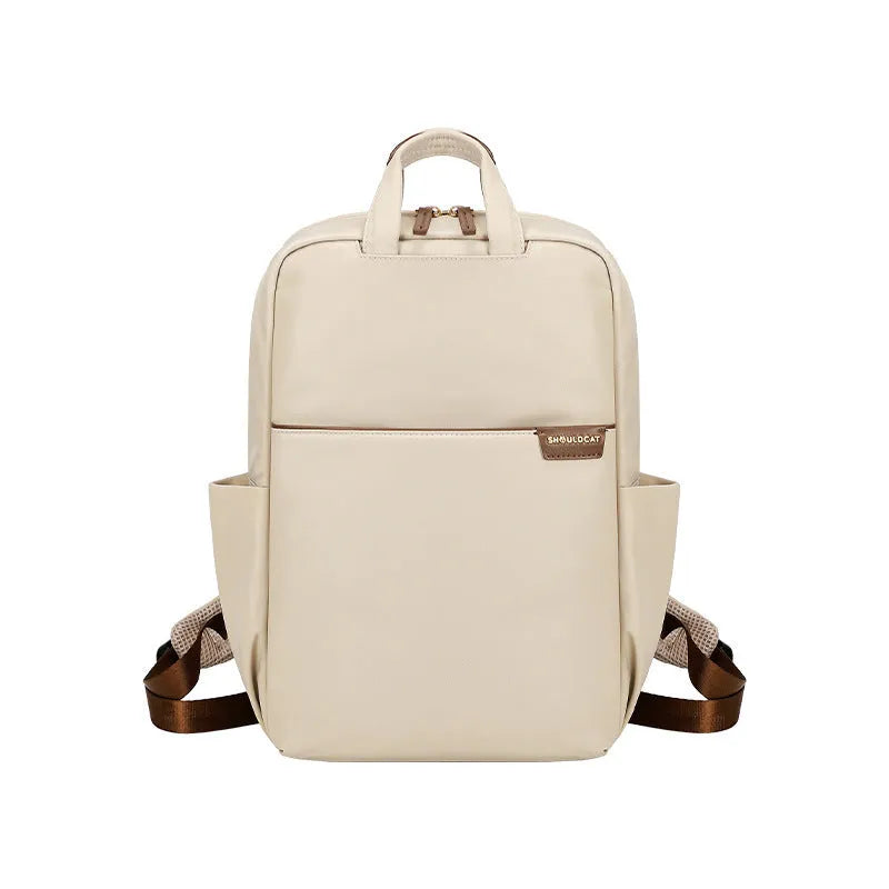 Women's large capacity canvas travel backpack in apricot colour showing external pockets and internal laptop compartment.