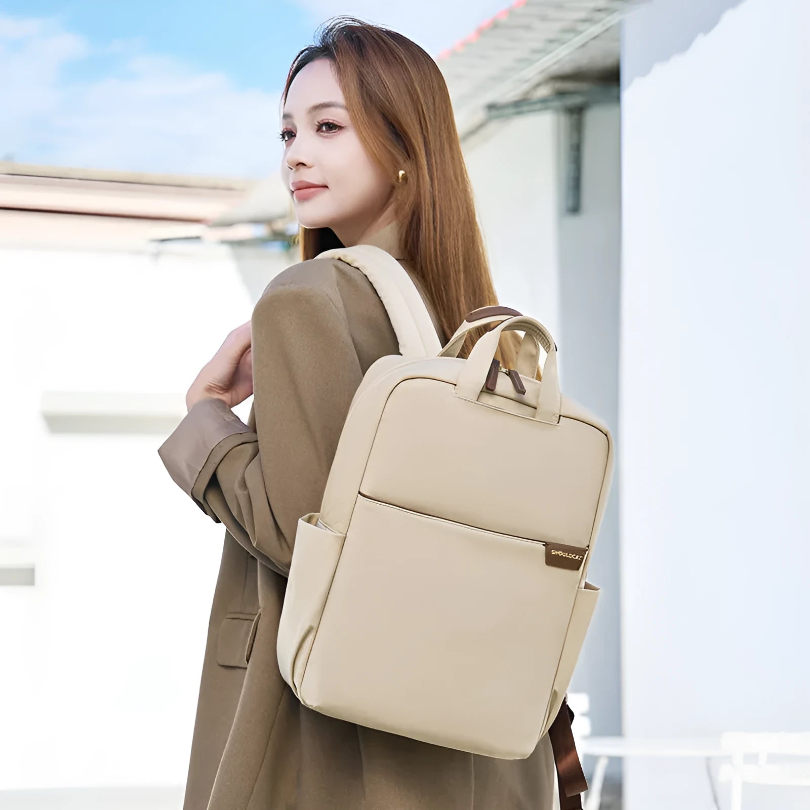 Women's large capacity canvas travel backpack in apricot colour showing external pockets and internal laptop compartment.