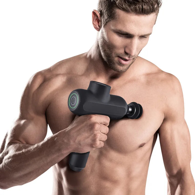 Handheld black muscle massager with six different coloured attachment heads on a white background.