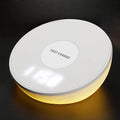 White Qi wireless charging pad with LED digital clock display and three control buttons