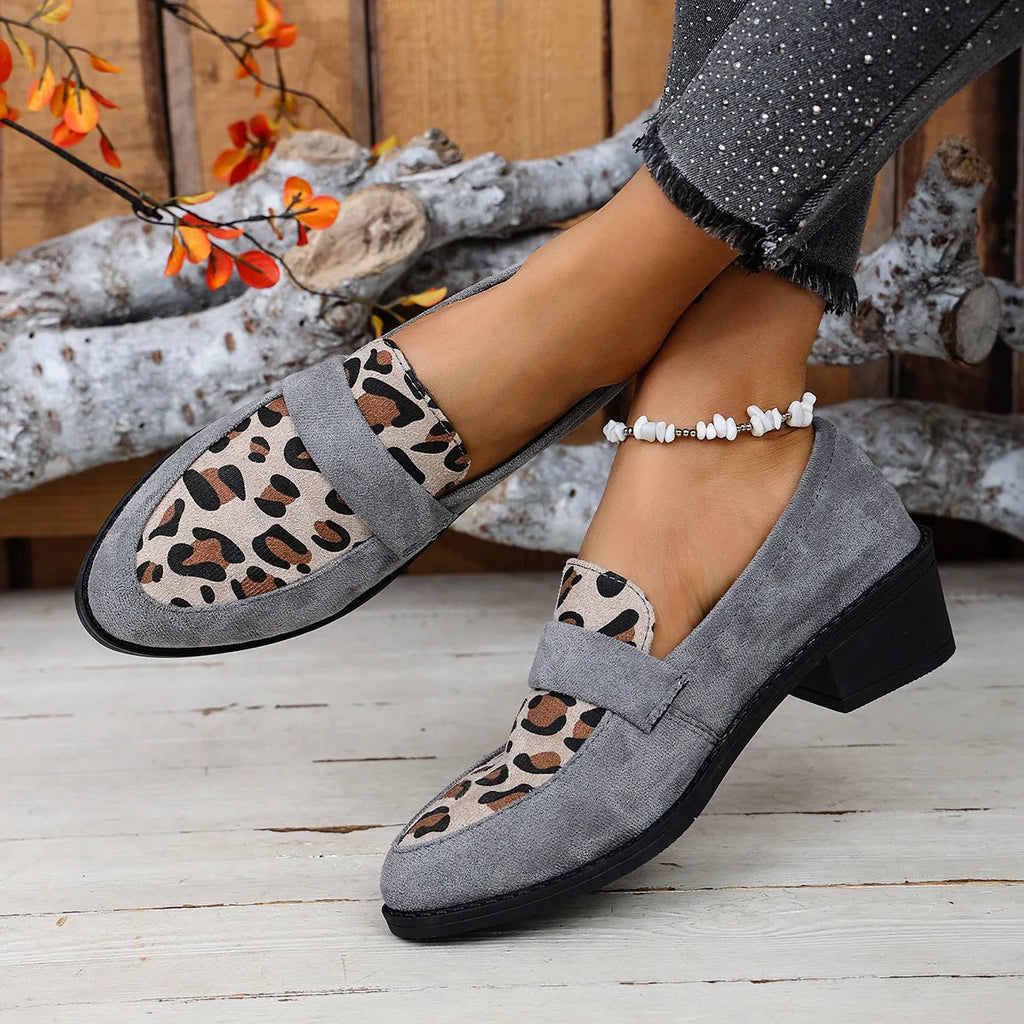 Leopard print suede slip-on shoes with a chunky mid heel and pointed toe on a rubber sole