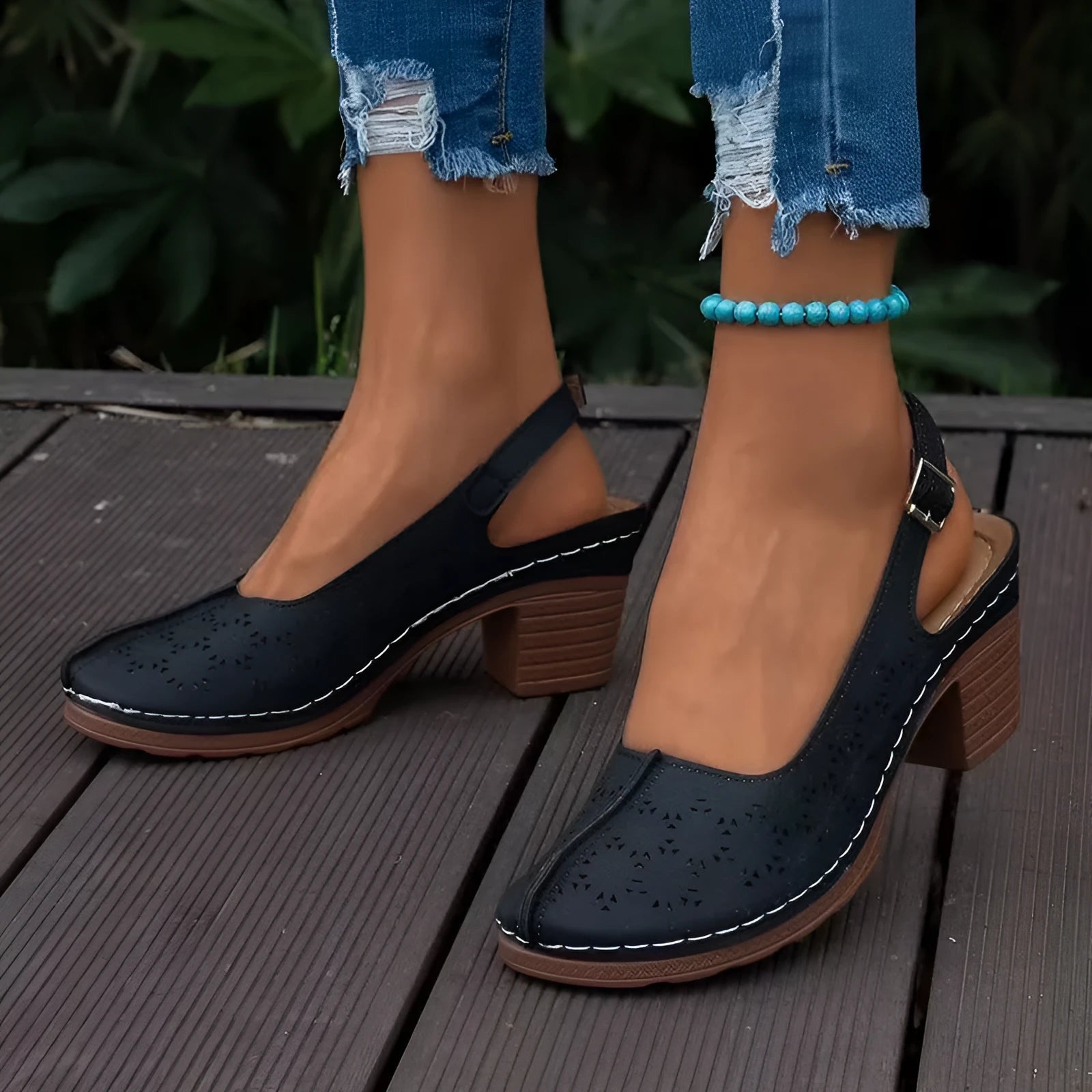 Women's black closed toe wedge sandals with round toe and rubber sole.