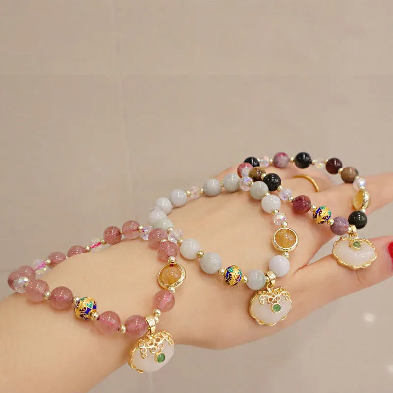 Geometric ethnic bracelet with natural jade, strawberry quartz stones and metal decorations
