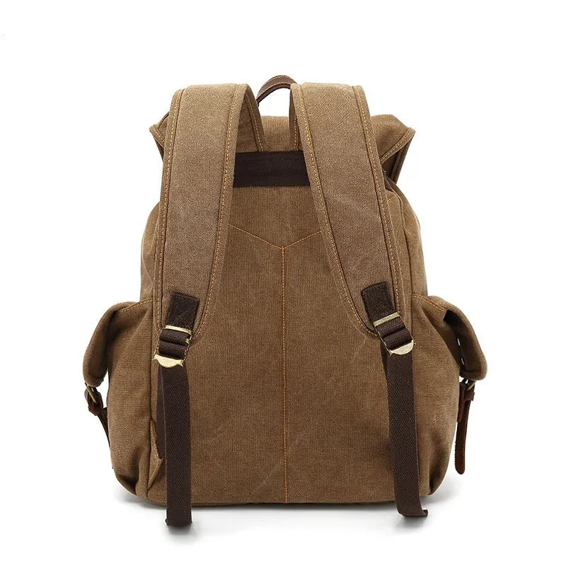 Retro-style army green canvas backpack with antique bronze hardware, shown closed.