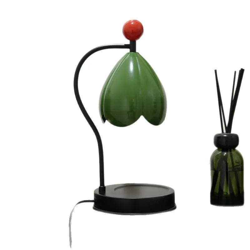 Linglan cream white metal holder melting wax desk lamp on a wooden table.