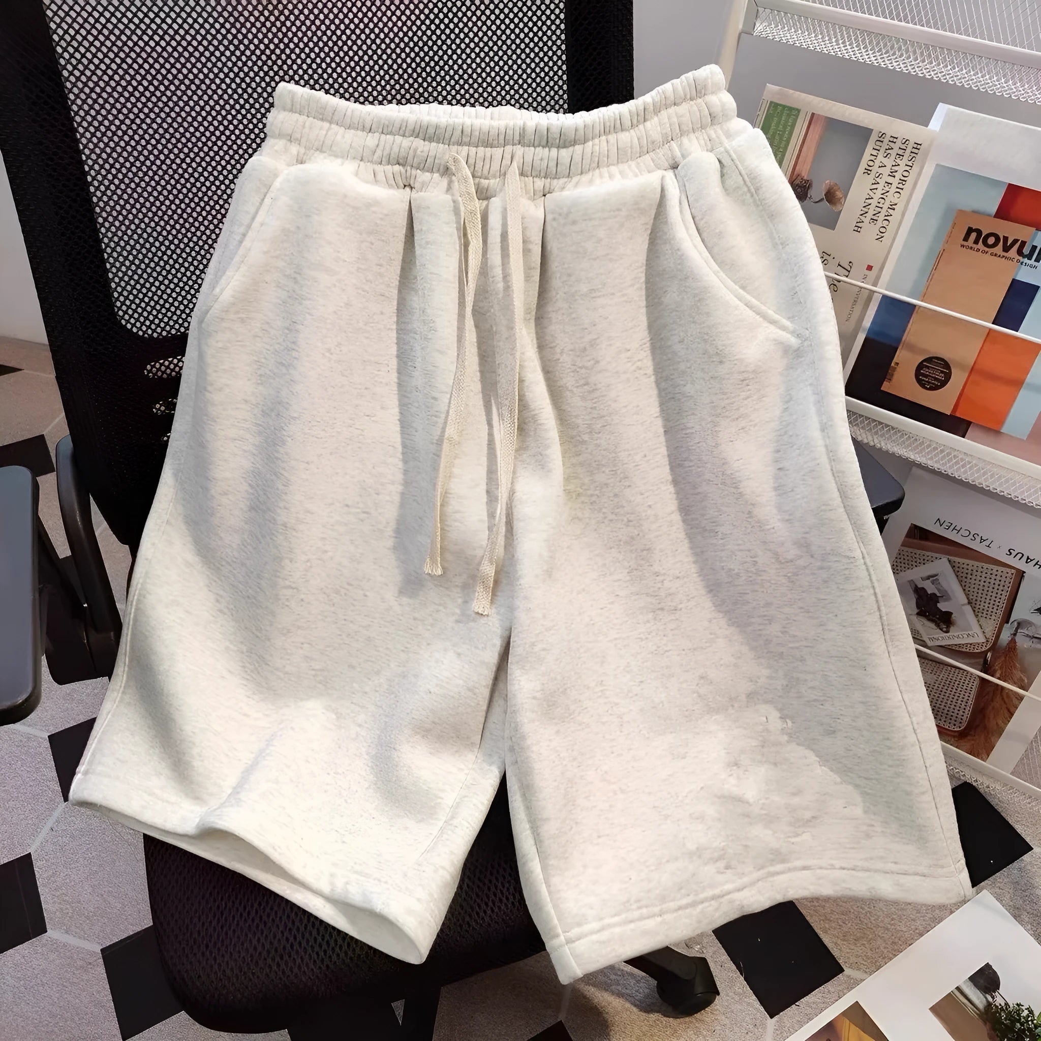 Men's loose fit polyester casual shorts in solid colour for summer, side view