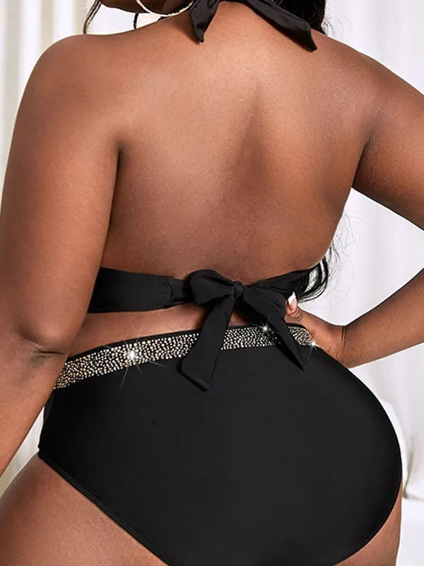 Black plus size women's two-piece bikini swimsuit on hanger