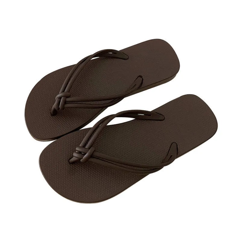 Men's PVC flip flop slippers in beige with a toe-covering design and injection moulded sole.
