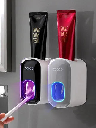 Wall mounted automatic toothpaste holder dispenser set with toothbrush slots and upside-down mouthwash cup in black plastic