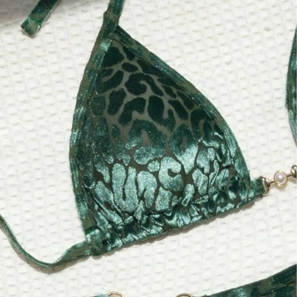 Women's blue leopard print T-shaped swimsuit bikini made from polyester and spandex fabric.