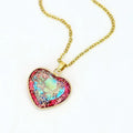 Red and blue heart-shaped emperor stone pendant necklace on a metal chain
