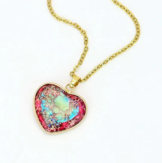 Red and blue heart-shaped emperor stone pendant necklace on a metal chain
