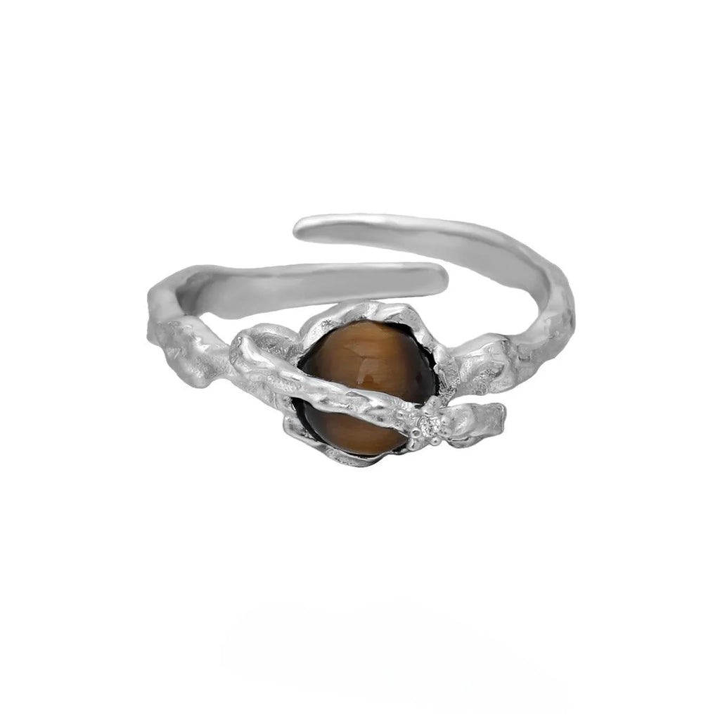 Saturn-themed adjustable open ring in electroplated white gold colour with tigereye gemstone detail