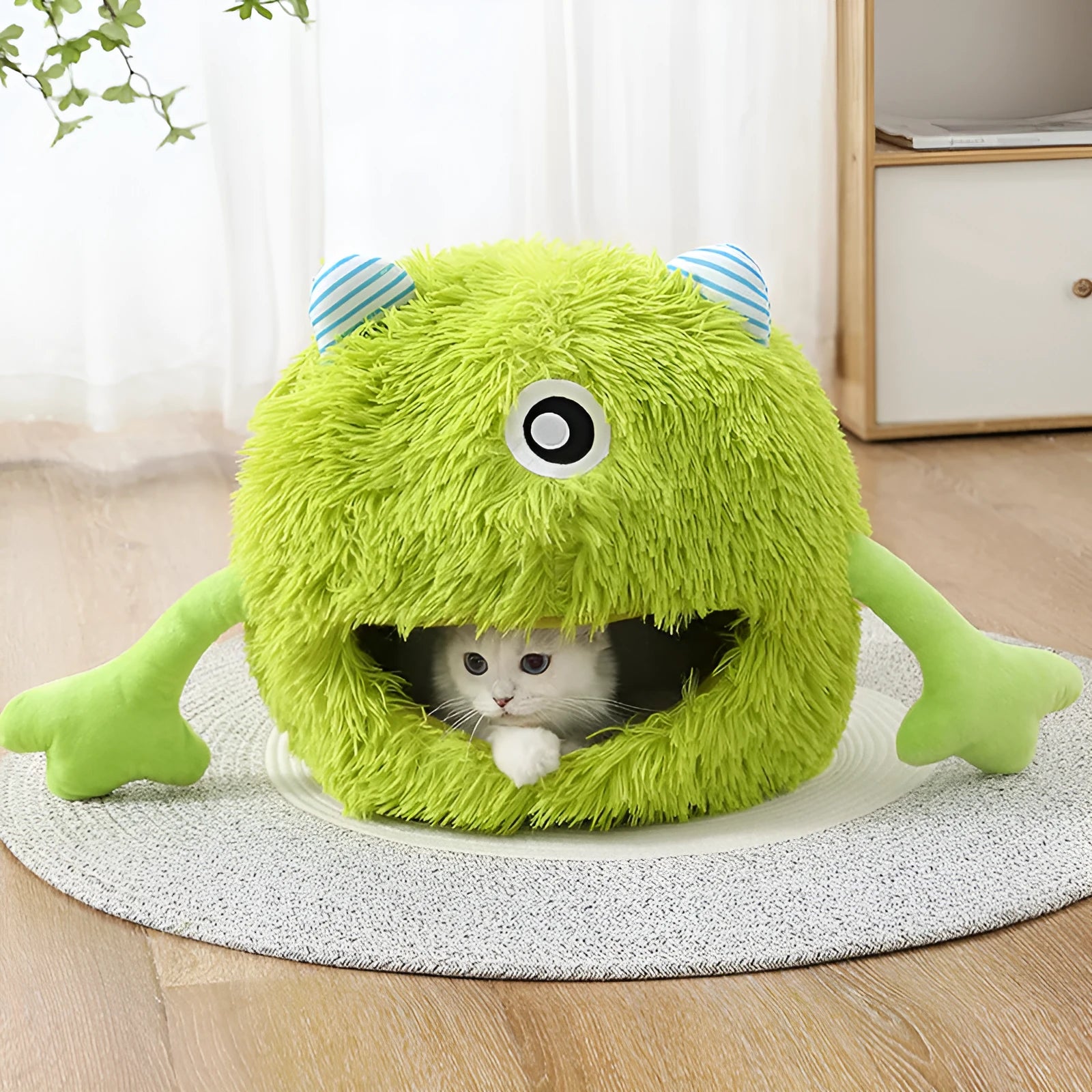 Fluffy round plush cat bed with non-slip base, shown in three sizes: small, medium, and large.