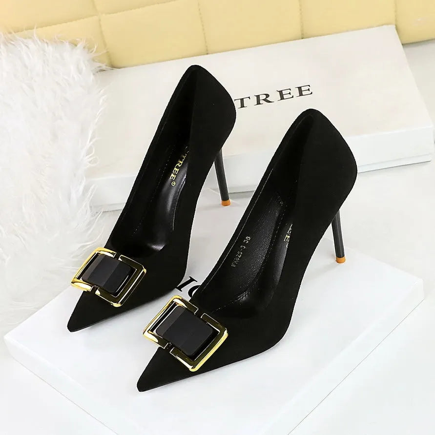 Black suede women's stiletto high heels with a pointed toe and 9cm heel on a white background.