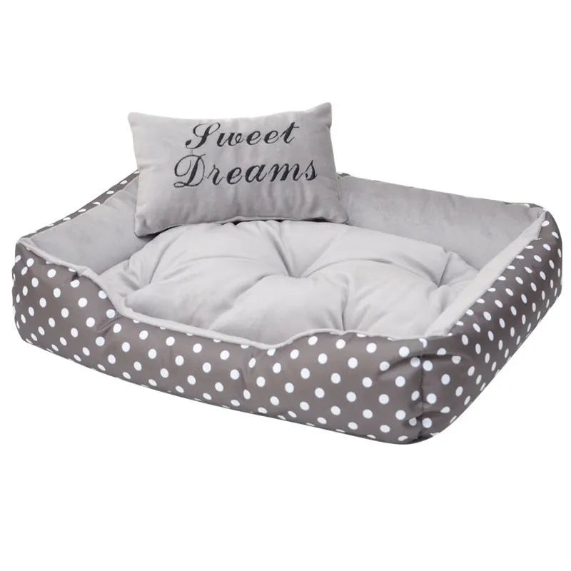 Printed polka dot square nest dog bed with matching pillow in grey, blue, pink, or red.
