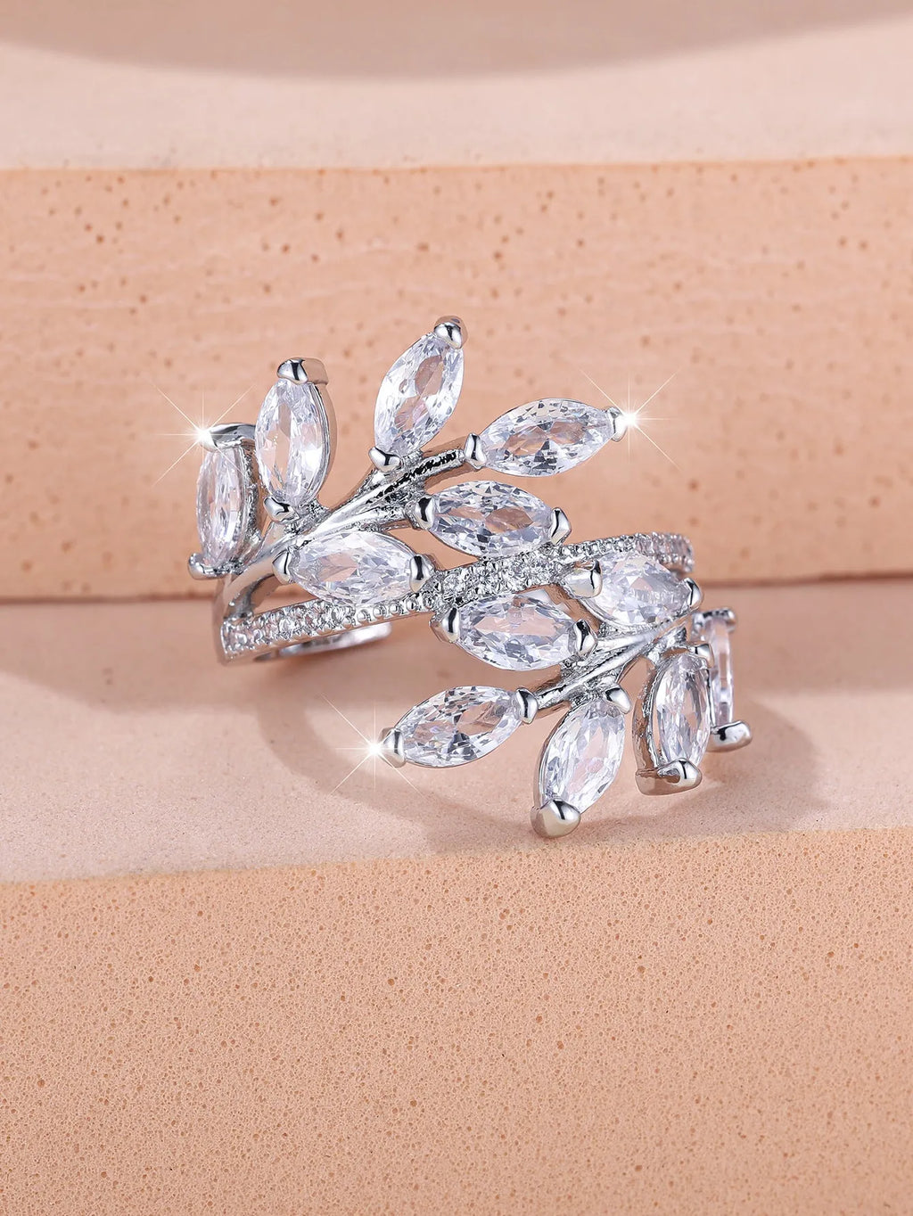 Adjustable copper leaf-shaped fashion ring with a central horse eye zircon stone in a rose gold finish.