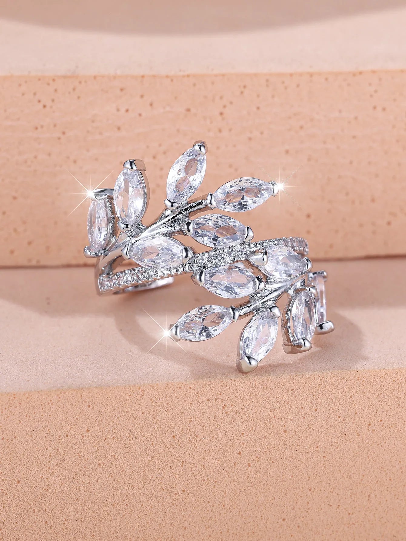 Adjustable copper leaf-shaped fashion ring with a central horse eye zircon stone in a rose gold finish.