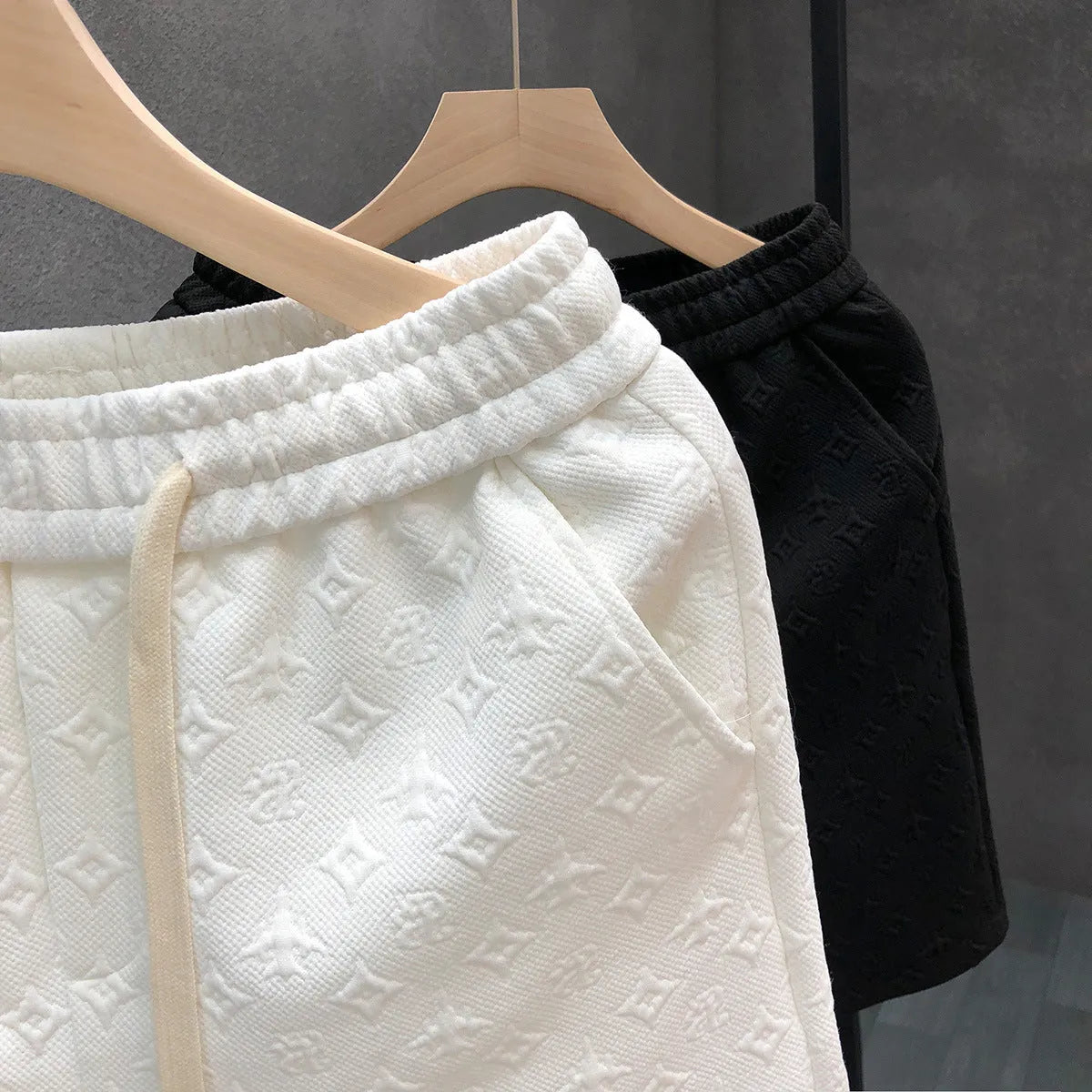 White jacquard shorts for men with straight cut and micro elastic fabric, displayed on a model