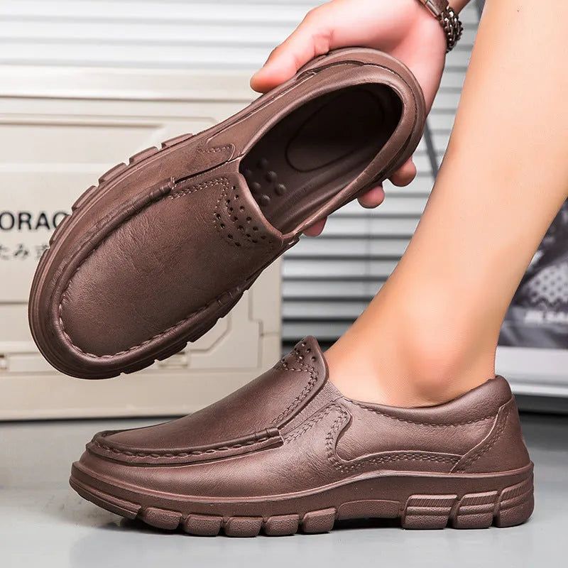 Men's black slip-on work shoes with waterproof platform heel and artificial leather upper
