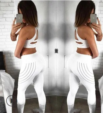 Women's black Milk Silk fitness leggings with night-glowing print, high-waisted pencil pants style.
