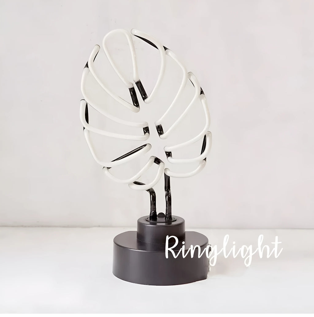 White bamboo-shaped desk lamp with green light, showing large and small size options.