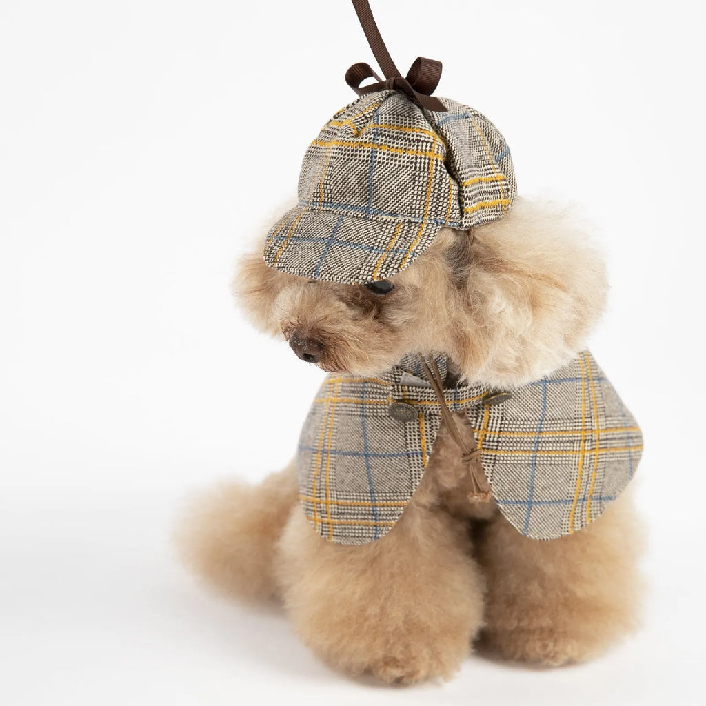 Camel-coloured cotton detective cloak for a dog on a mannequin, showing the hood with adjustable hat.