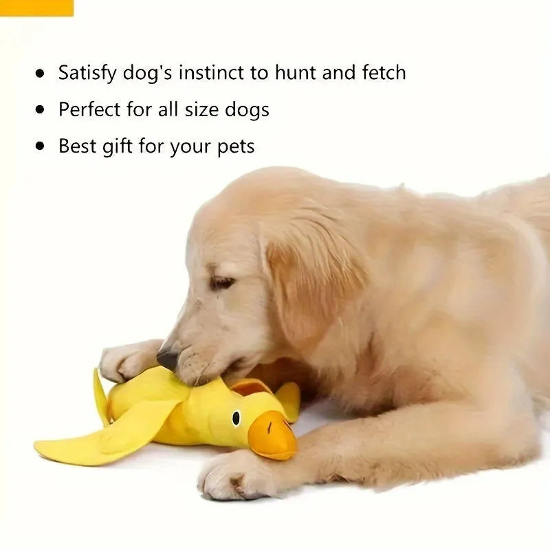Yellow plush dog toy with attached rubber duck and a treat slot on a white background.