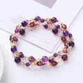 Women's handmade adjustable bracelet with tourmaline, strawberry quartz, and amethyst crystals