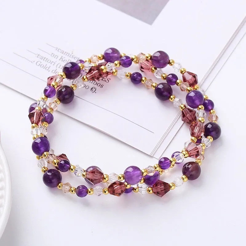 Women's handmade adjustable bracelet with tourmaline, strawberry quartz, and amethyst crystals