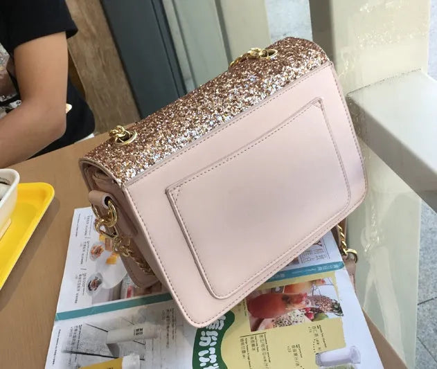 Women's small square sequined PU handbag with lock closure and adjustable shoulder strap in pink, wathet, and black colours 22x16x9cm