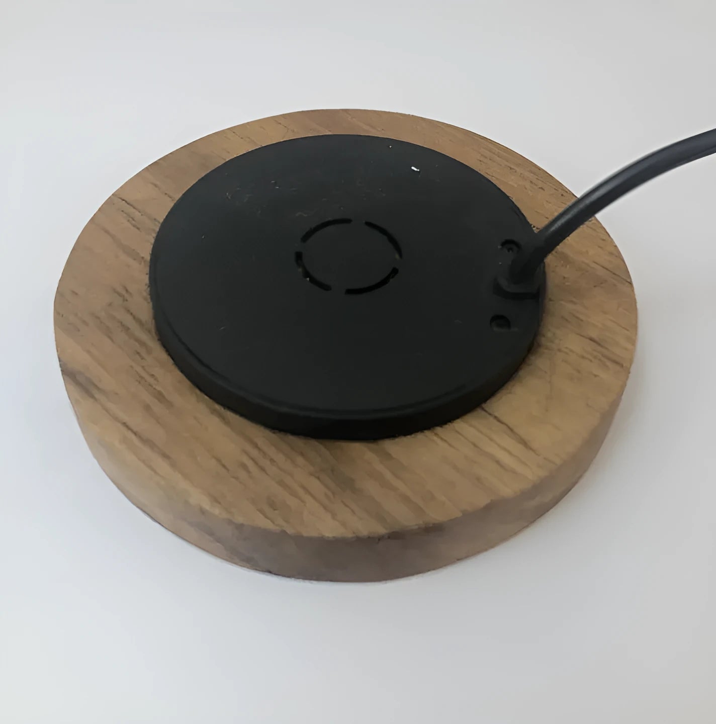 60mm round wireless charging pad for embedding into furniture surfaces with USB cable connection