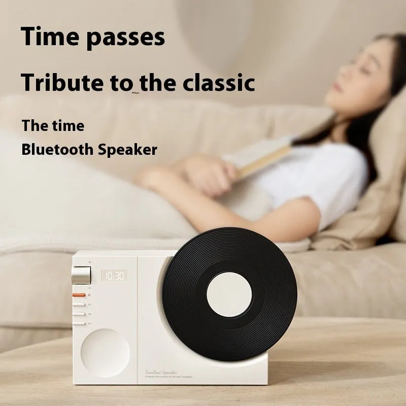 Mini Bluetooth portable speaker with card insertion slot in obsidian black, ivory white, coral pink, or plum green colour